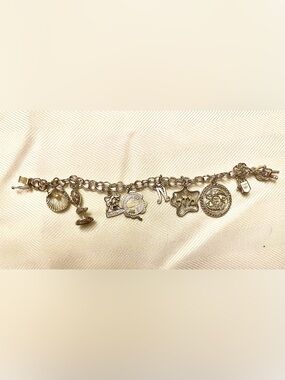 Vintage Sterling silver stamped Bracelet with Assorted sterling silver Charms